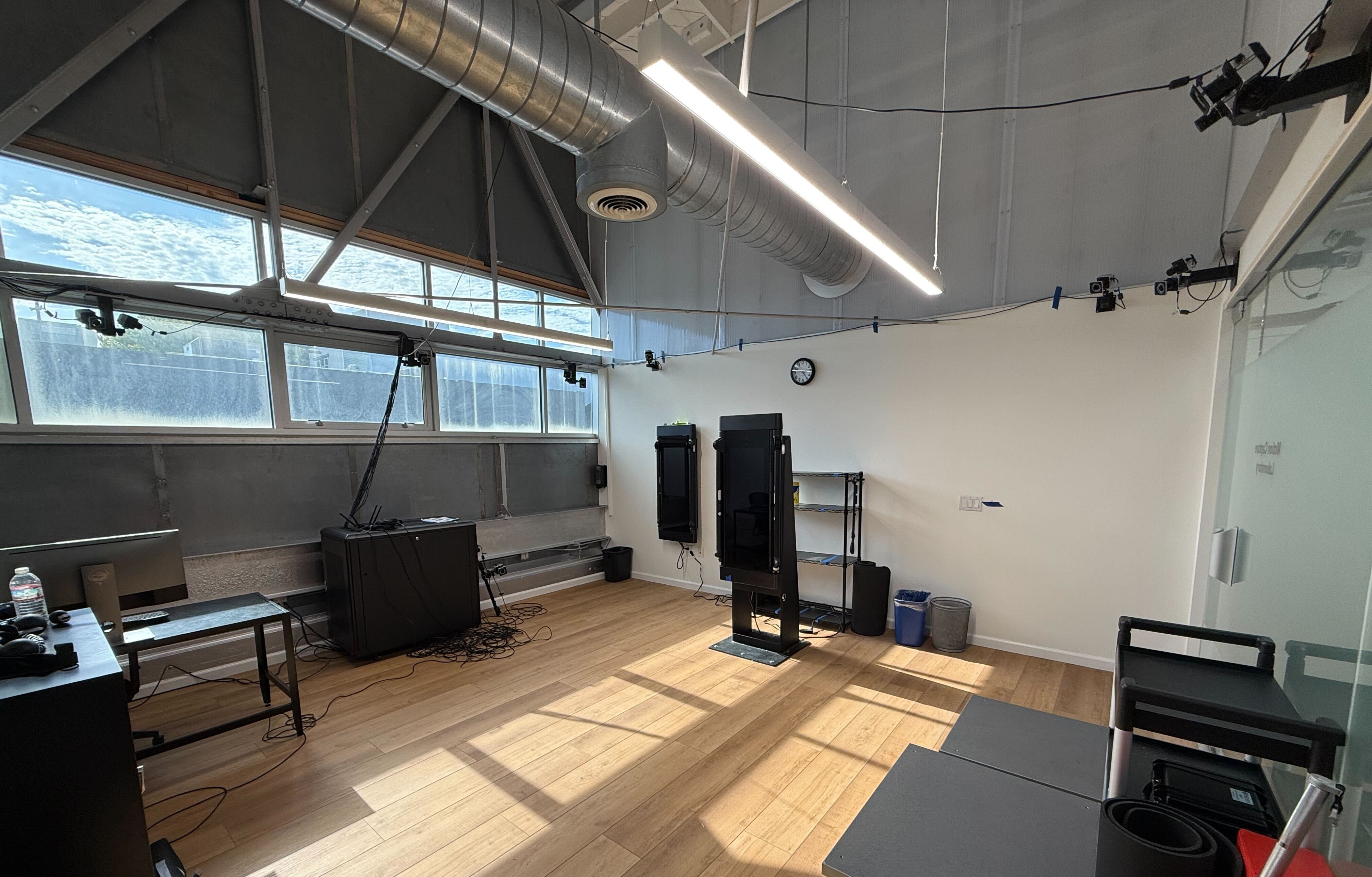 Motion capture laboratory with a Tonal trainer at the center of a Vicon camera rig